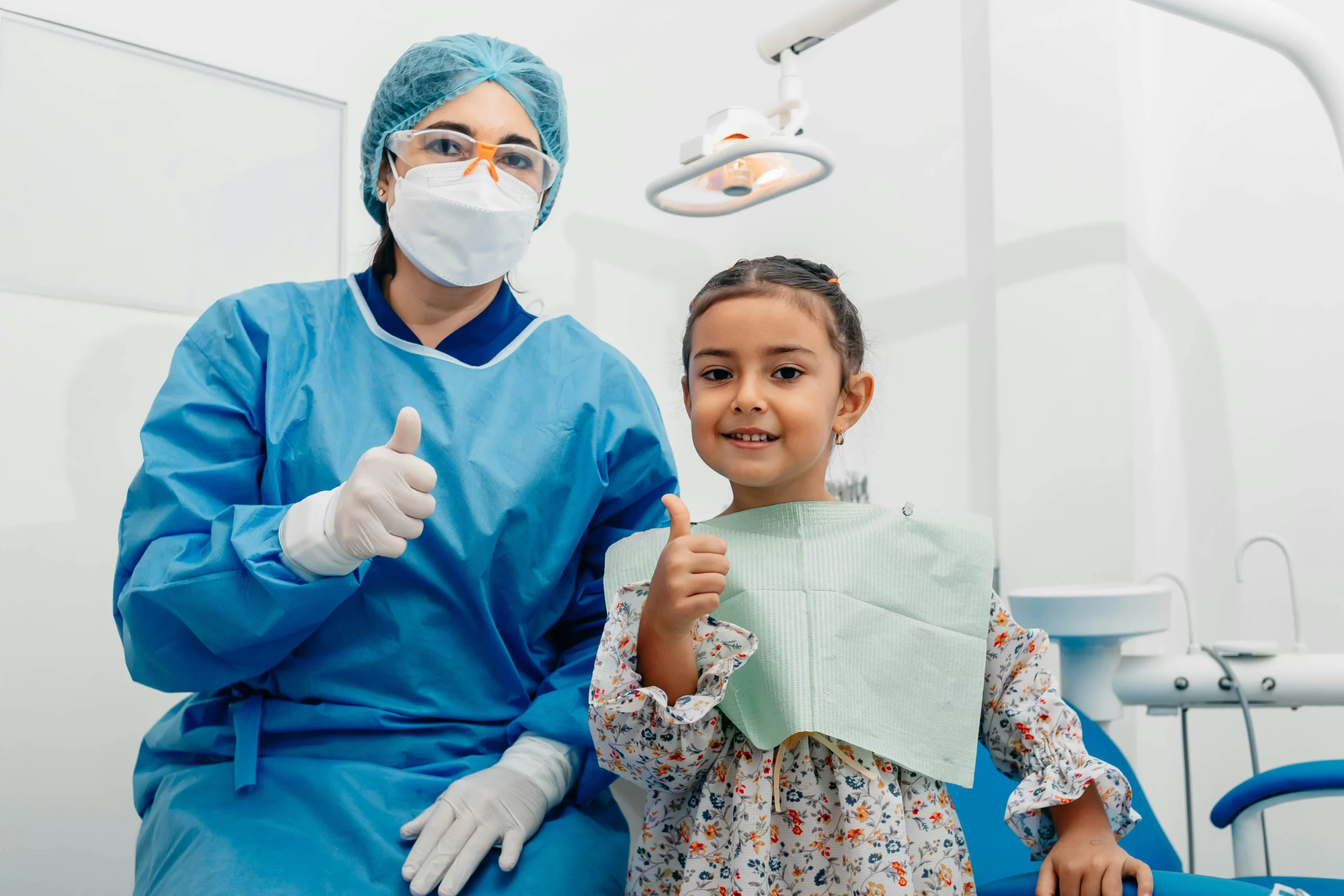 A dentist and her patient inside the clinic.